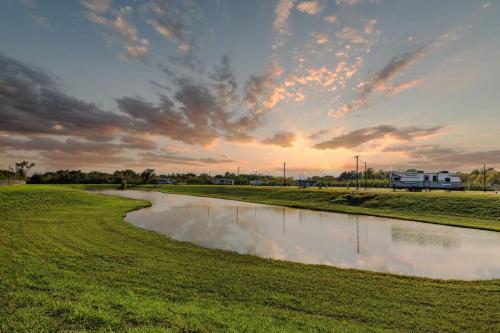 Sunset over the fishing pond at the Medical Center RV Resort in Houston, Texas. 